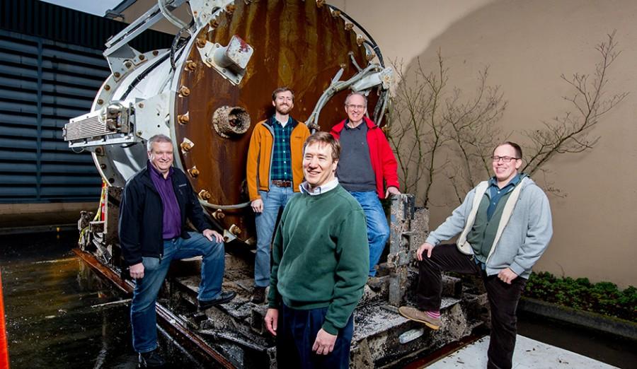 The Natick team poses next to one of the containers.