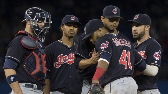Cleveland+Indians+starting+pitcher+Carlos+Carrasco%2C+centre+right%2C+is+congratulated+by+teammate+Carlos+Santana+%2841%29+as+he+prepares+to+leave+the+mound+during+the+eighth+inning+against+the+Toronto+Blue+Jays+in+a+baseball+game+Thursday%2C+June+30%2C+2016%2C+in+Toronto.+%28Chris+Young%2FThe+Canadian+Press+via+AP%29