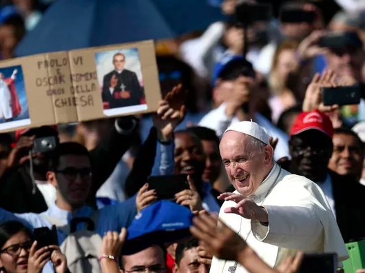 Pope Francis waves to the excited crowd who came to see the canonization.