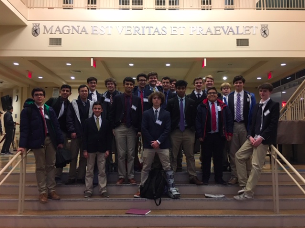 The Model UN team stands at the atrium of Horace Mann School in New York City, New York. 