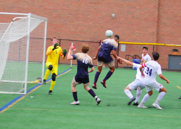 Senior Captain Nicholas Jardim (#7) beats the goalkeeper with a powerful header off a beautiful free kick from Junior Marcelo Friere to tie the game at 1-1 vs. GL on Monday.)
