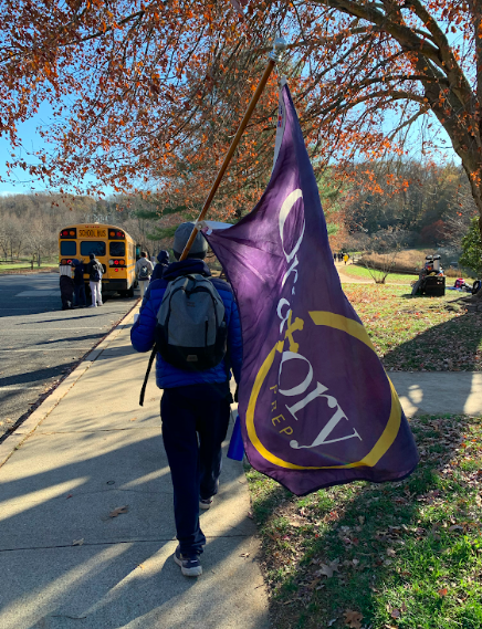 William Heffernan carries the Oratory flag after the meet