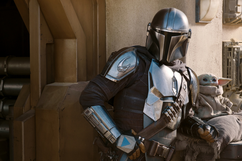 The Mandalorian (Pedro Pascal) and the Child in THE MANDALORIAN, season two, exclusively on Disney+. Image courtesy of Indie Wire.